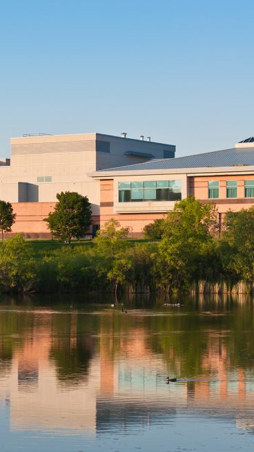 Community Center Building Reflected in a Pond
